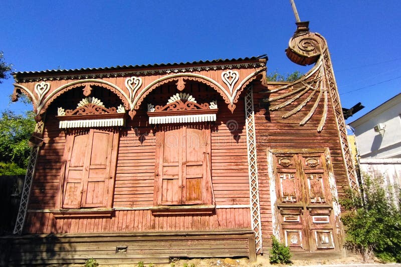 Vintage wooden house with ornamental carved windows, frames in Chita city, Russia. V. N. Konovalov house (Amurskaya Street, 108). Chita landmark. Chita monument. Russian style in Chita architecture