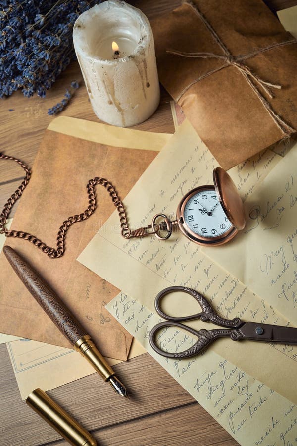 Vintage Writing Utensils on a Wooden Table, Old Watch, Papers ...