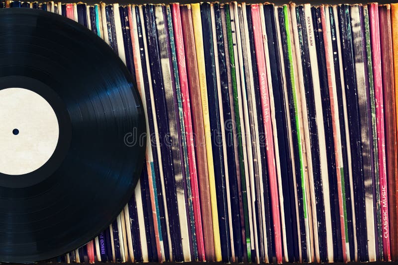 Vinyl record with copy space in front of a collection of albums (dummy titles)