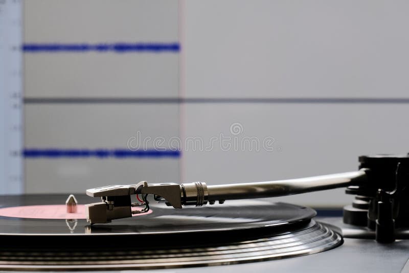 Vinyl Record and Turntable during Analog To Digital Audio Conversion Using Computer Stock Photo