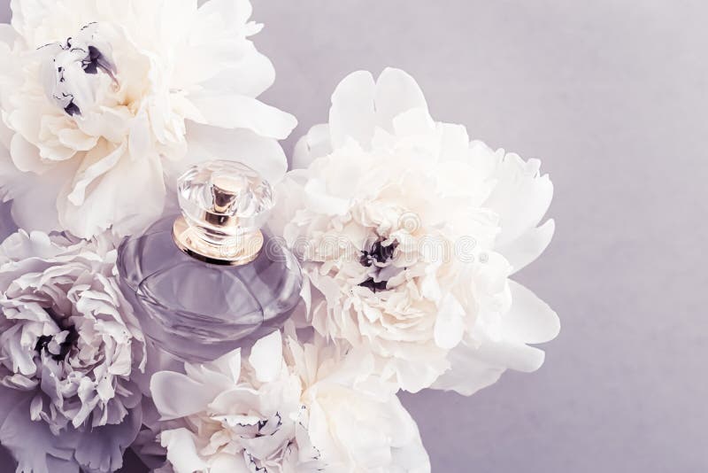 Violet Fragrance Bottle As Luxury Perfume Product On Background Of Peony  Flowers, Parfum Ad And Beauty Branding Design Stock Photo, Picture and  Royalty Free Image. Image 149590294.