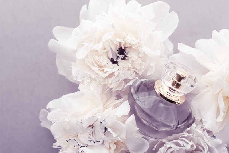 Violet Fragrance Bottle As Luxury Perfume Product On Background Of Peony  Flowers, Parfum Ad And Beauty Branding Design Stock Photo, Picture and  Royalty Free Image. Image 149590294.