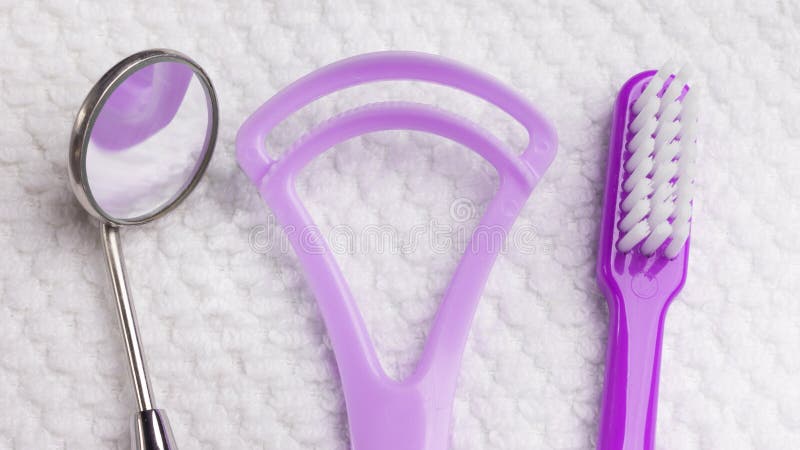 Violet toothbrush with dental tools stock image Violet toothbrush with dental tools stock image