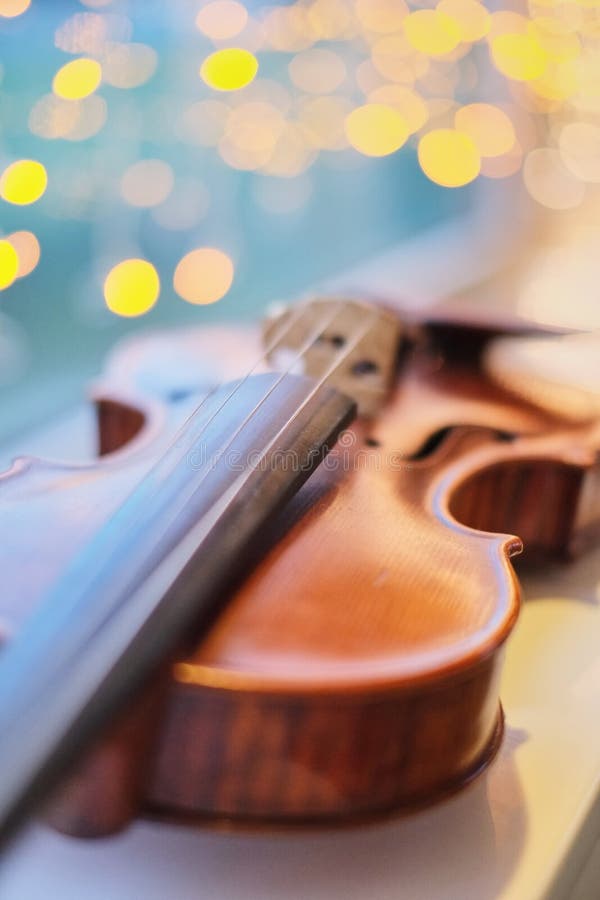 Violin with Blurred Perspective Bokeh Light Blue Bokeh Background Stock