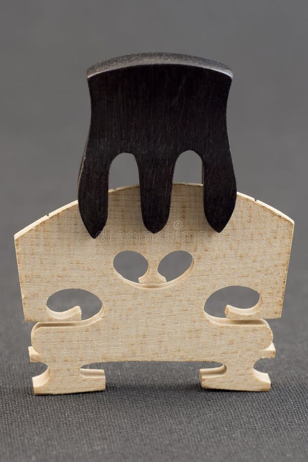 Violin bridge with sordine royalty free stock image