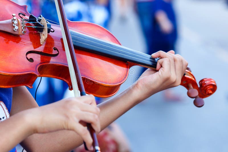 Violin,Hand on the strings of a violin. stock photography Violin,Hand on the strings of a violin. stock photography