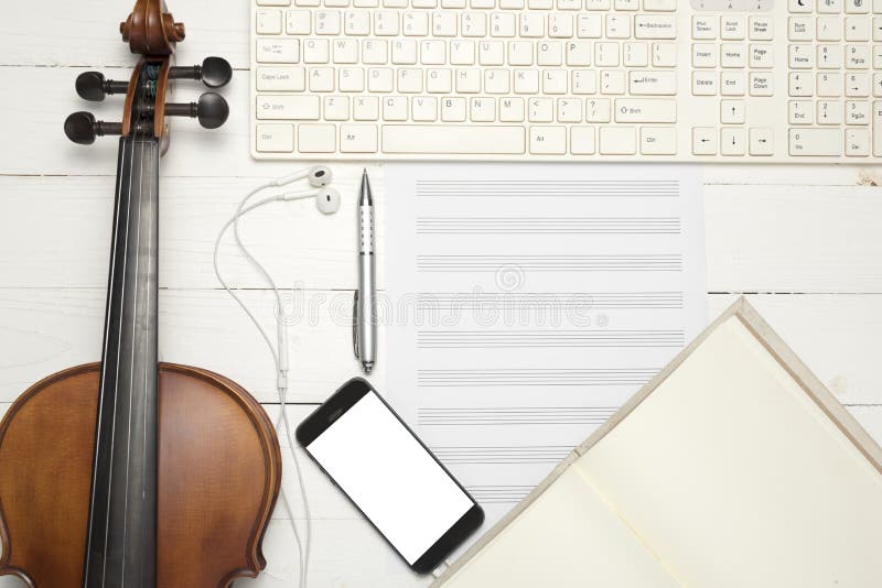 violin with keyboard computer music paper note notebook and smart phone