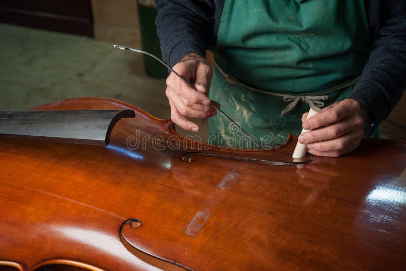 The violinmaker stock image. Image of holes, adjustment 79005367