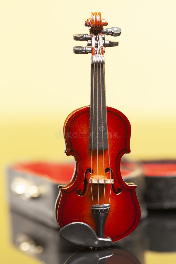 Violin with Red Velvet Case on a Yellow Background. Stock Photo Image