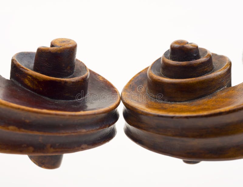 Violin scrolls stock photography