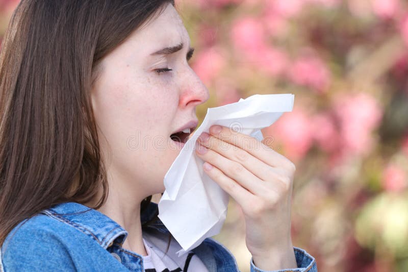 Viral Infection, Girl With Runny Nose Is Sneezing In The