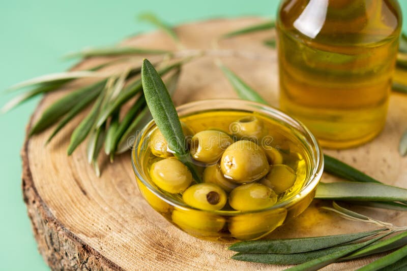 Virgin Olive Oil Bottle and Green Olives Stock Photo - Image of liquid