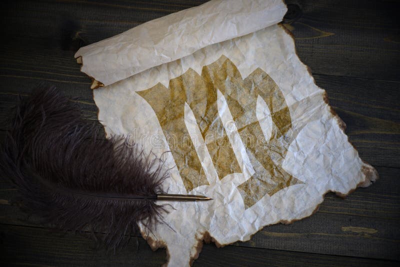 Virgo sign of the zodiac on vintage paper with old pen on the wooden desk stock image Virgo sign of the zodiac on vintage paper with old pen on the wooden desk stock image