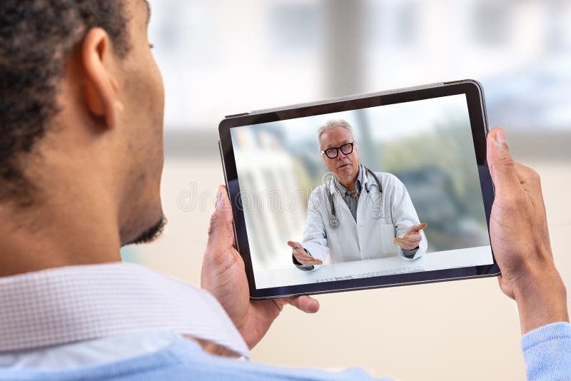 Virtual live chat with the patient with digital tablet and a doctor via internet. In-home care for a young male patient