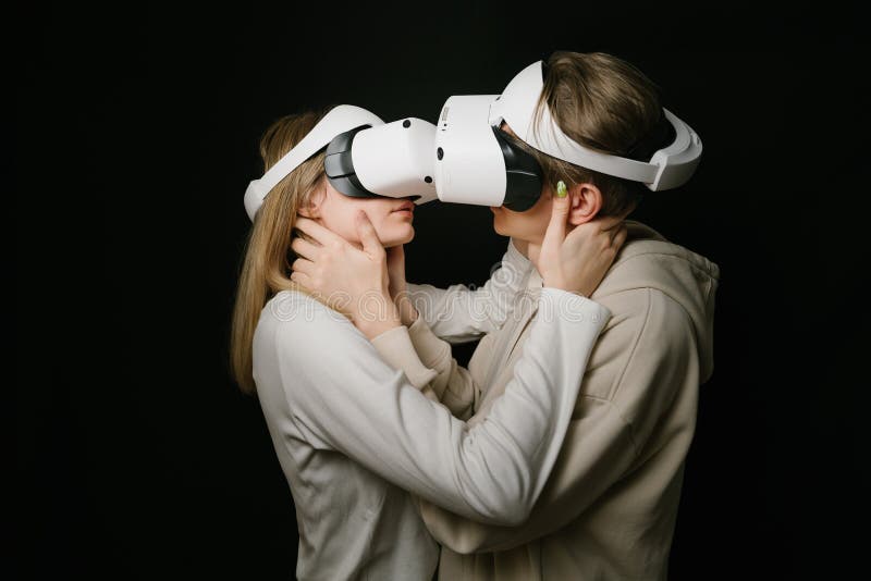 Virtual Lovers Couple Hugging and Kissing in VR Headset Glasses. Stock
