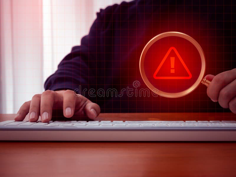 Virus alert. Red triangle icon, System hacked error sign, malware, attention danger symbol warning showing in magnifying glass royalty free stock photo