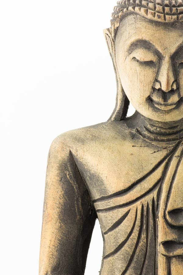 Visage du découpage en bois de Bouddha d'isolement sur le fond blanc photo stock Visage du découpage en bois de Bouddha d'isolement sur le fond blanc photo stock