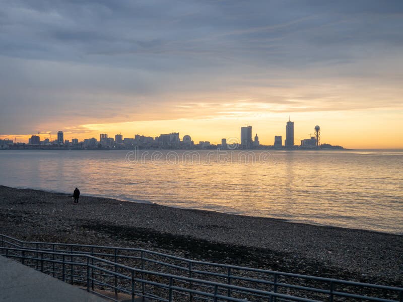 View of the sea modern city. Batumi from afar. Tall houses on the sea. Beautiful landscape. Georgia. Batumi at sunset. View of the sea modern city. Batumi from afar. Tall houses on the sea. Beautiful landscape. Georgia. Batumi at sunset