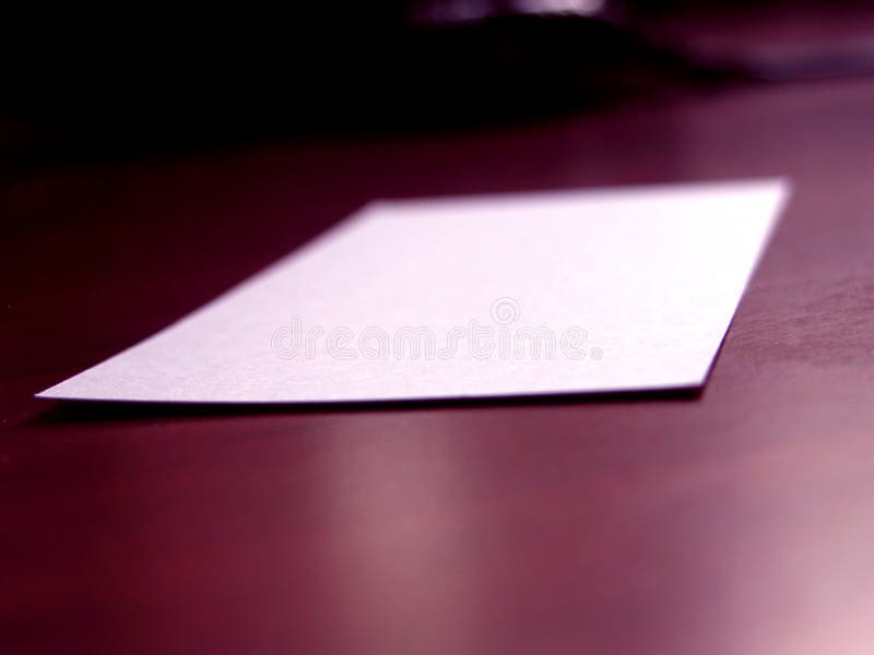 Blank business card on a wooden desk. Shallow depth of field was used, front part is sharp in focus. Blank business card on a wooden desk. Shallow depth of field was used, front part is sharp in focus.