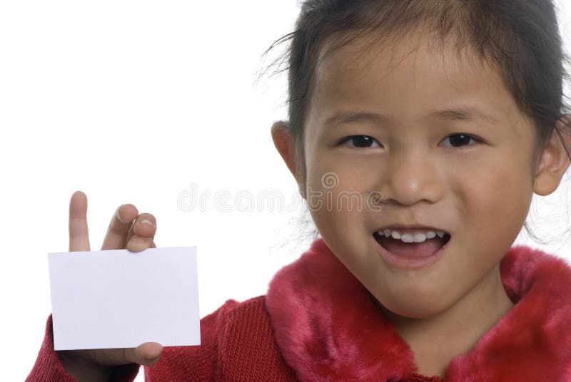 A young girl shows off a blank business card. A young girl shows off a blank business card