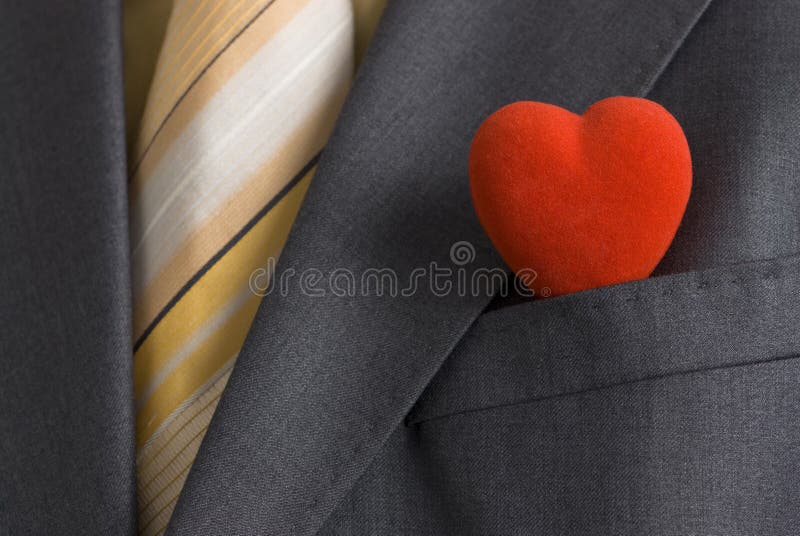 A red heart in a suit pocket representing the business card of modern Mr. Valentine. A red heart in a suit pocket representing the business card of modern Mr. Valentine.