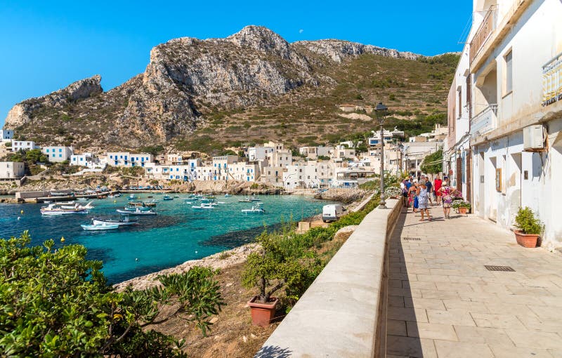 Visitors enjoy the coastline during their trip of small village on Levanzo island, the smallest of the Egadi. royalty free stock image Visitors enjoy the coastline during their trip of small village on Levanzo island, the smallest of the Egadi. royalty free stock image