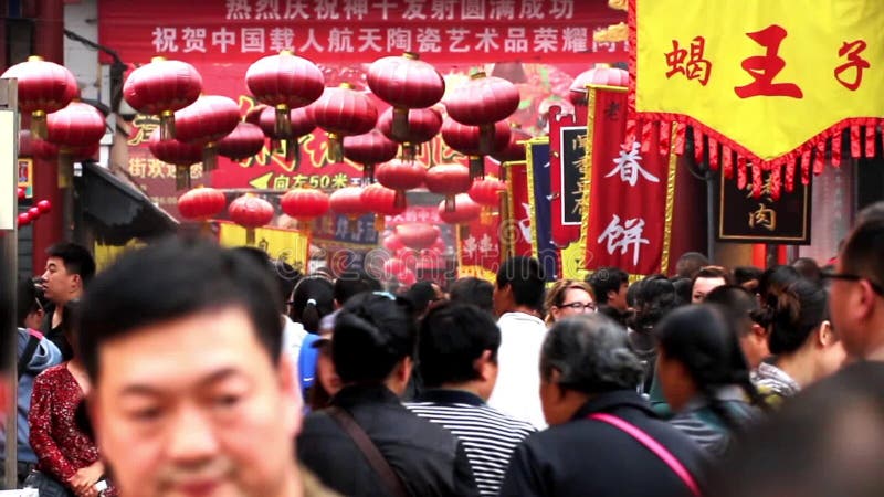 Visitors go in and out Wangfujing Snack Street