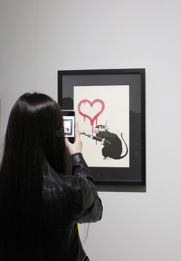 Visitors take photos in a Banksy unauthorized exhibition royalty free stock photography Visitors take photos in a Banksy unauthorized exhibition royalty free stock photography