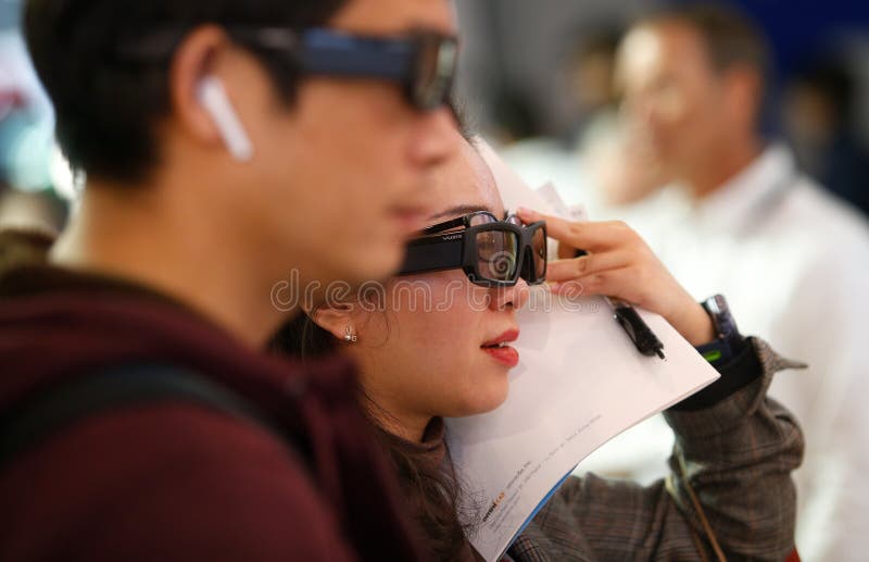 Visitors testing AR optical systems at MWC 2019 stock photo Visitors testing AR optical systems at MWC 2019 stock photo