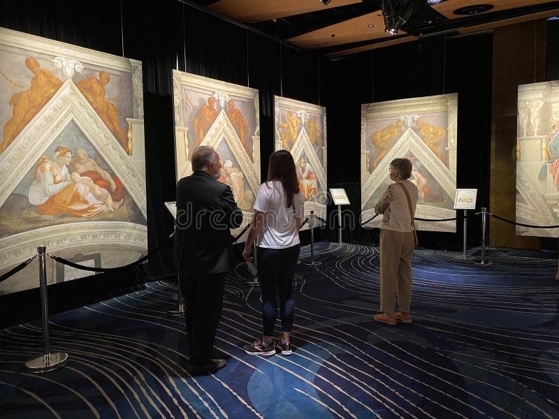 Jan 18, 2022, AUCKLAND, NEW ZEALAND: Visitors view ceiling fresco paintings in Sistine Chapel by Michelangelo in the Michelangelo A Different View exhibition at Aotea Center in Auckland, New Zealand. Jan 18, 2022, AUCKLAND, NEW ZEALAND: Visitors view ceiling fresco paintings in Sistine Chapel by Michelangelo in the Michelangelo A Different View exhibition at Aotea Center in Auckland, New Zealand