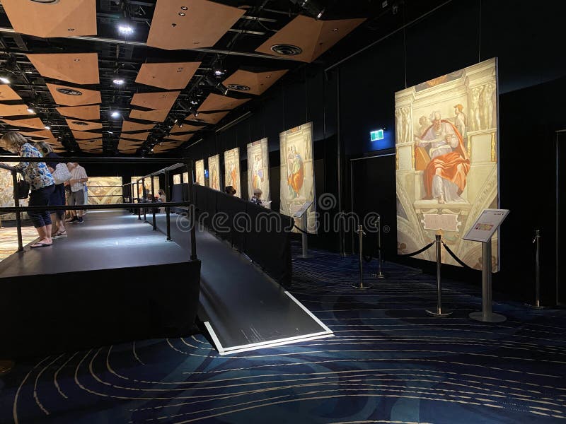 Jan 18, 2022, AUCKLAND, NEW ZEALAND: Visitors view ceiling fresco paintings in Sistine Chapel by Michelangelo in the Michelangelo A Different View exhibition at Aotea Center in Auckland, New Zealand. Jan 18, 2022, AUCKLAND, NEW ZEALAND: Visitors view ceiling fresco paintings in Sistine Chapel by Michelangelo in the Michelangelo A Different View exhibition at Aotea Center in Auckland, New Zealand