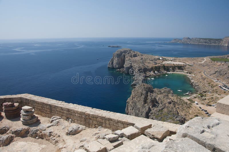 A view from the acropolis of Lindos to the coastline and the natural harbour, Rhodes. A view from the acropolis of Lindos to the coastline and the natural harbour, Rhodes
