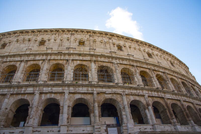 Glimpse of the Colosseum in the morning, in  Rome illuminated by daylight. Glimpse of the Colosseum in the morning, in  Rome illuminated by daylight