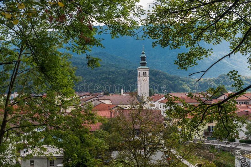 Glimpse of Kobarid, in Slovenia, through trees. Glimpse of Kobarid, in Slovenia, through trees