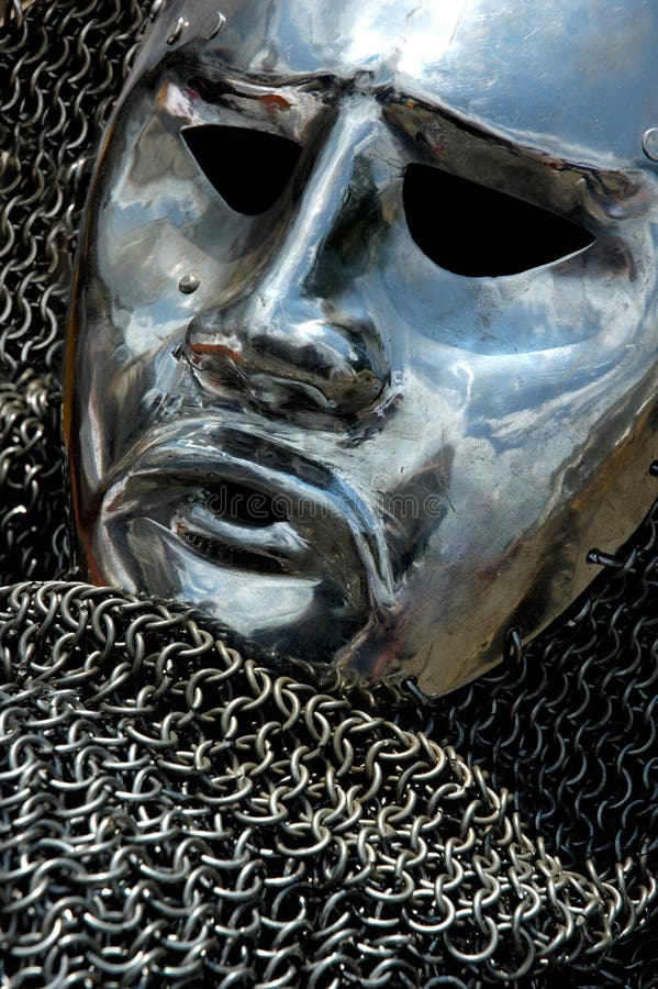 Antique metal helmet shining chrome mask and chain mail. Antique metal helmet shining chrome mask and chain mail.