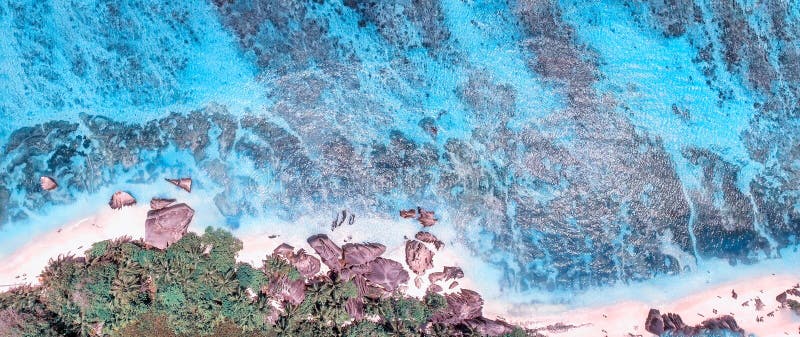 Overhead aerial view of Anse Source Argent Beach in La Digue, Seychelle Islands - Africa. Overhead aerial view of Anse Source Argent Beach in La Digue, Seychelle Islands - Africa