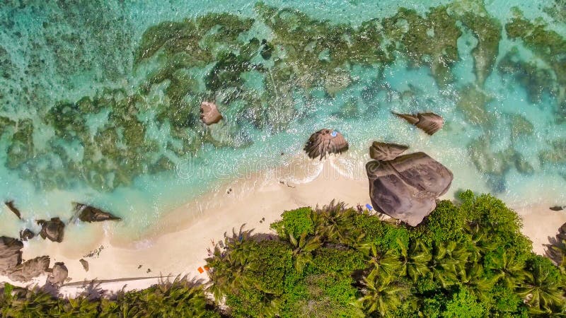 Overhead aerial view of Anse Source Argent Beach in La Digue, Seychelle Islands - Africa. Overhead aerial view of Anse Source Argent Beach in La Digue, Seychelle Islands - Africa