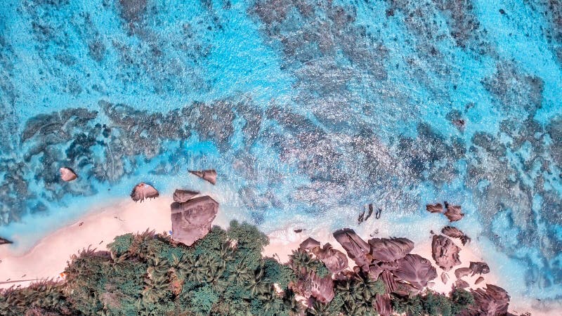 Overhead aerial view of Anse Source Argent Beach in La Digue, Seychelle Islands - Africa. Overhead aerial view of Anse Source Argent Beach in La Digue, Seychelle Islands - Africa