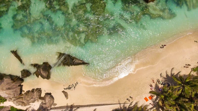 Overhead aerial view of Anse Source Argent Beach in La Digue, Seychelle Islands - Africa. Overhead aerial view of Anse Source Argent Beach in La Digue, Seychelle Islands - Africa