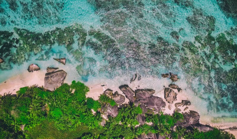 Overhead aerial view of Anse Source Argent Beach in La Digue, Seychelle Islands - Africa. Overhead aerial view of Anse Source Argent Beach in La Digue, Seychelle Islands - Africa