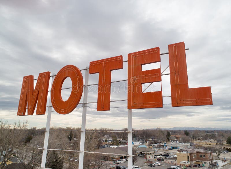 Angled view of a motel sign above a city. Angled view of a motel sign above a city