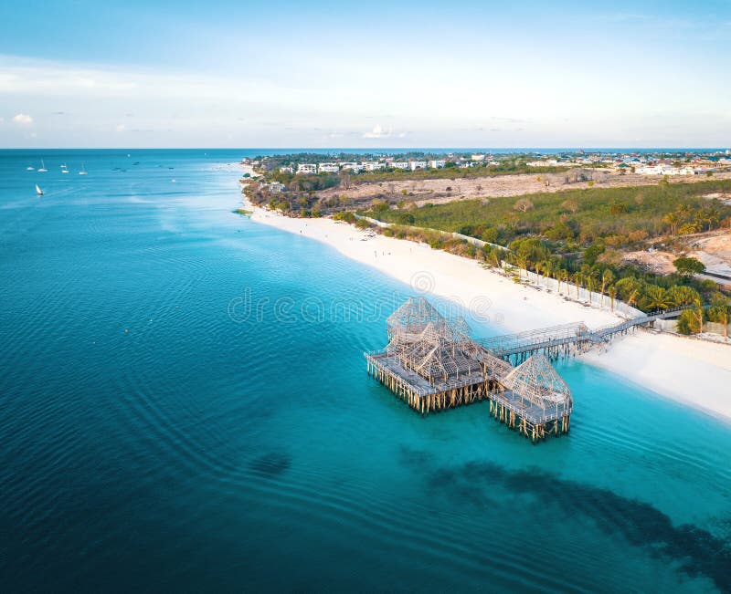 Aerial view of Kendwa beach in Zanzibar, Tanzania with luxury resort and turquoise ocean water. Toned image. Aerial view of Kendwa beach in Zanzibar, Tanzania with luxury resort and turquoise ocean water. Toned image