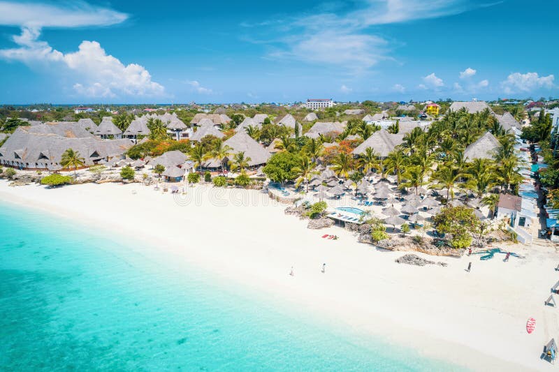 Aerial view of Nungwi beach in Zanzibar, Tanzania with luxury resort and turquoise ocean water. Toned image. Aerial view of Nungwi beach in Zanzibar, Tanzania with luxury resort and turquoise ocean water. Toned image