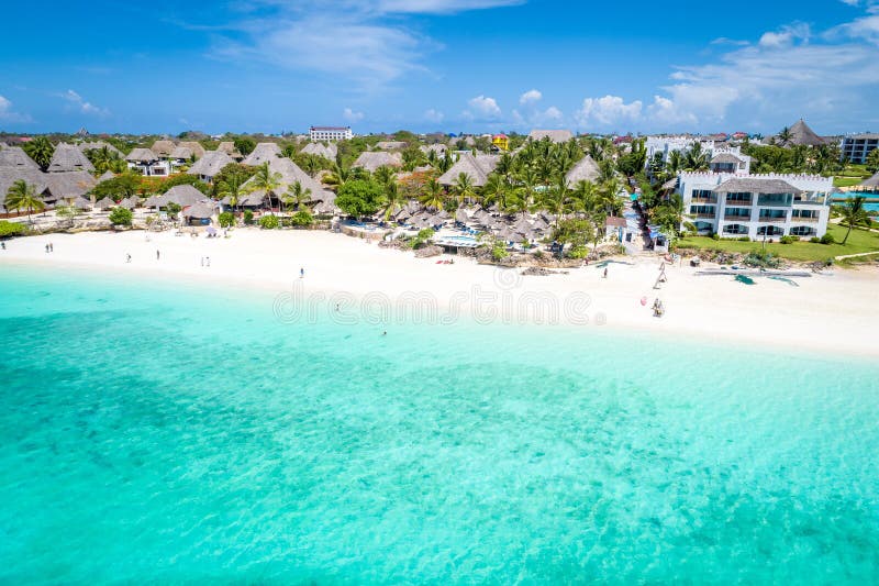 Aerial view of Nungwi beach in Zanzibar, Tanzania with luxury resort and turquoise ocean water. Toned image. Aerial view of Nungwi beach in Zanzibar, Tanzania with luxury resort and turquoise ocean water. Toned image