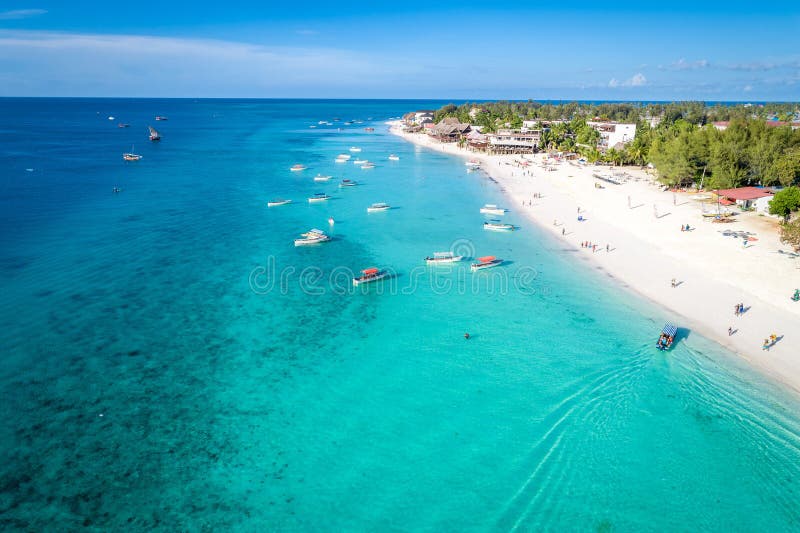 Aerial view of Nungwi beach in Zanzibar, Tanzania with luxury resort and turquoise ocean water. Toned image. Aerial view of Nungwi beach in Zanzibar, Tanzania with luxury resort and turquoise ocean water. Toned image