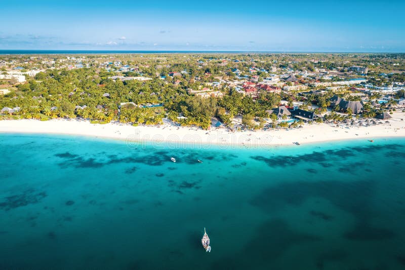 Aerial view of Nungwi beach in Zanzibar, Tanzania with luxury resort and turquoise ocean water. Toned image. Aerial view of Nungwi beach in Zanzibar, Tanzania with luxury resort and turquoise ocean water. Toned image