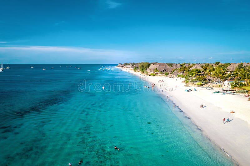 Aerial view of Nungwi beach in Zanzibar, Tanzania with luxury resort and turquoise ocean water. Toned image. Aerial view of Nungwi beach in Zanzibar, Tanzania with luxury resort and turquoise ocean water. Toned image