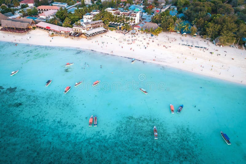 Aerial view of Nungwi beach in Zanzibar, Tanzania with luxury resort and turquoise ocean water. Toned image. Aerial view of Nungwi beach in Zanzibar, Tanzania with luxury resort and turquoise ocean water. Toned image