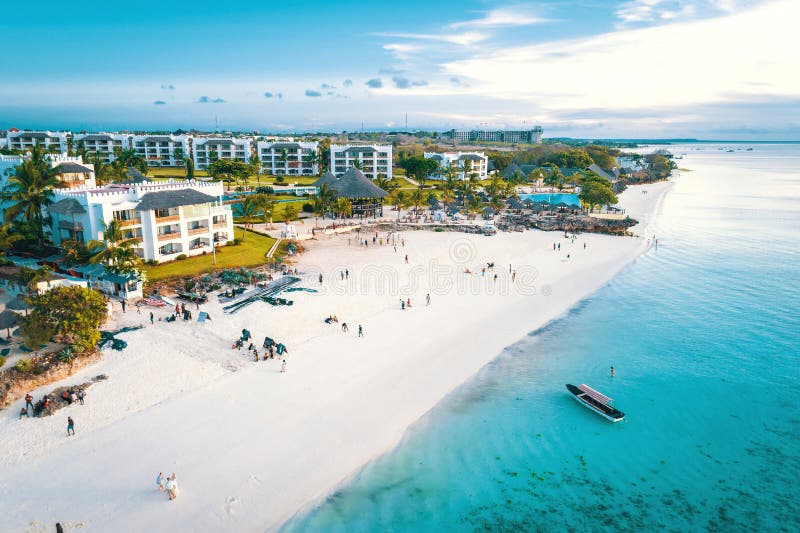 Aerial view of Nungwi beach in Zanzibar, Tanzania with luxury resort and turquoise ocean water. Toned image. Aerial view of Nungwi beach in Zanzibar, Tanzania with luxury resort and turquoise ocean water. Toned image