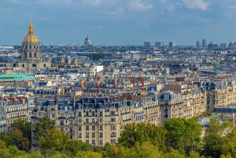 Aerial view of Paris, France, with buildings, roofs and Dome des Invalides, burial site of Napoleon Bonaparte. Aerial view of Paris, France, with buildings, roofs and Dome des Invalides, burial site of Napoleon Bonaparte.